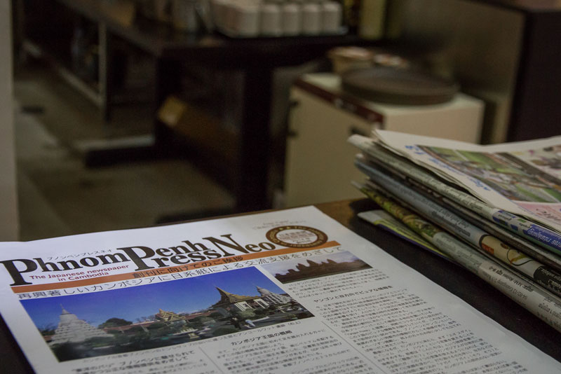 Copies of the Japanese-language Phnom Penh Press Neo lie on a table at the Sushi Garden restaurant in Phnom Penh. (Neou Vannarin/The Cambodia Daily)