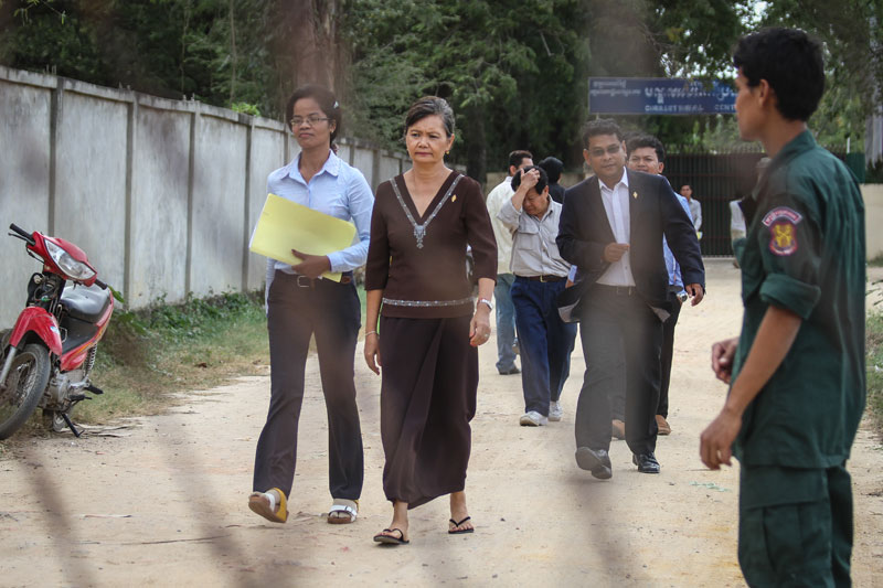 Opposition lawmaker Mu Sochua leaves Prey Sar prison on Monday after visiting 18 jailed activists, including 10 women on hunger strike. (Siv Channa/The Cambodia Daily)