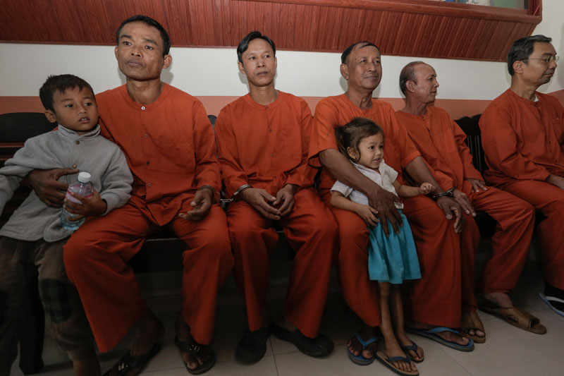 Court Charges Five Men Over Relic Theft 1 Five men charged with stealing relics of the Buddha from a stupa on Oudong Mountain in Kandal province sit outside the courtroom Tuesday at the Appeal Court in Phnom Penh. (Siv Channa/The Cambodia Daily)