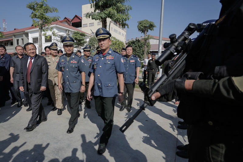 From left, Phnom Penh governor Pa Socheatvong, national military police Commander Sao Sokha and municipal Commander Rath Srieng arrive at the Phnom Penh military police headquarters for the municipal force's annual meeting Thursday afternoon. (Siv Channa/The Cambodia Daily)