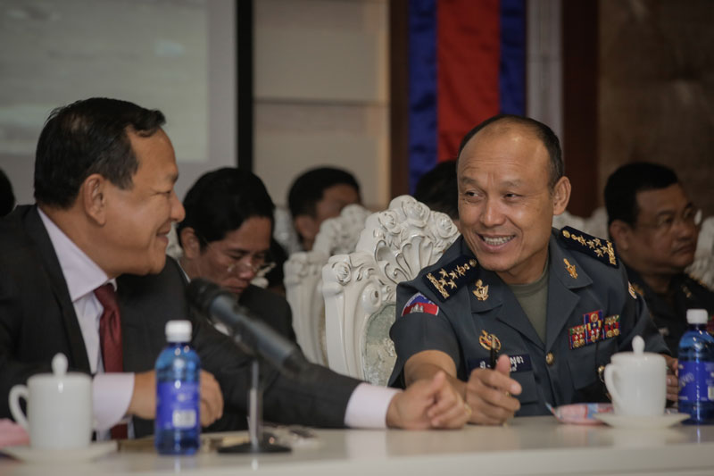 National Military Police Commander Sao Sokha speaks to Phnom Penh governor Pa Socheatvong during the municipal military police's annual meeting in Phnom Penh on Thursday. (Siv Channa/The Cambodia Daily)