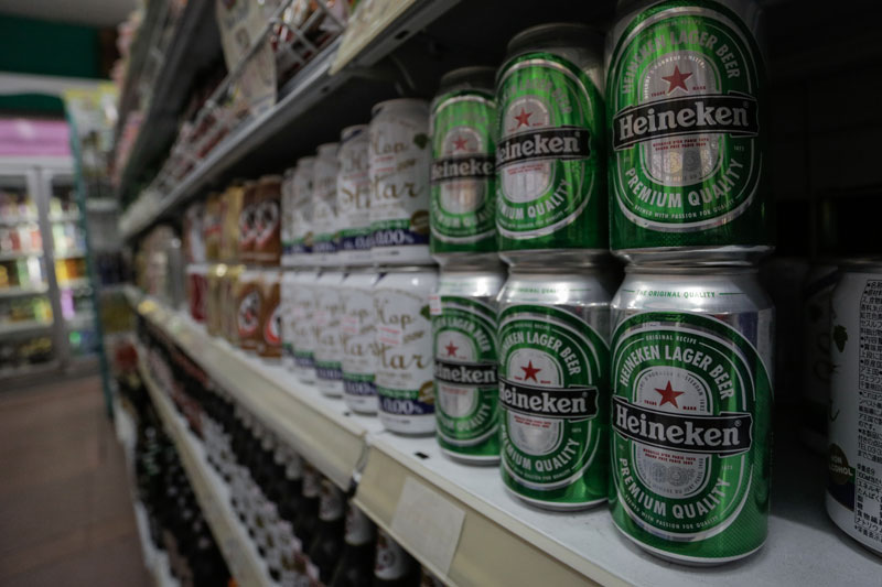 Cans of Heineken beer stacked on a shelf at a convenience store in Phnom Penh earlier this week (Siv Channa/The Cambodia Daily)