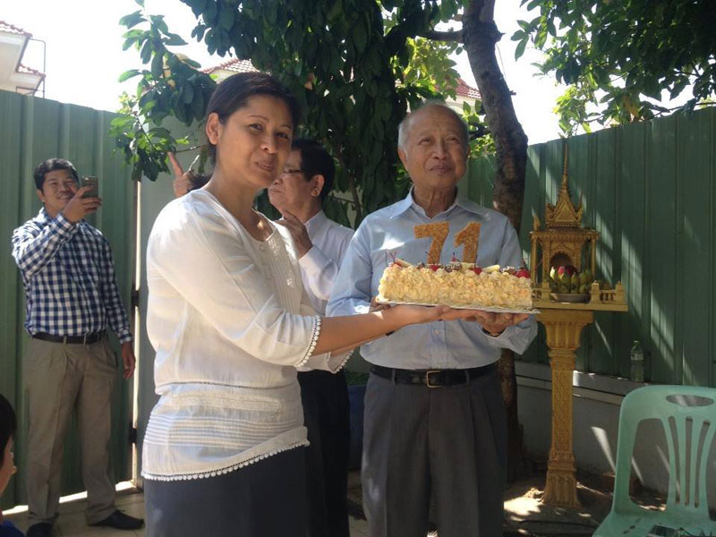 Ouk Phalla, the wife of Prince Norodom Ranariddh, presents her husband with a cream cake to mark his 71st birthday in Phnom Penh on Friday, in a photo posted to the Community of Royalist People Party's Facebook page.