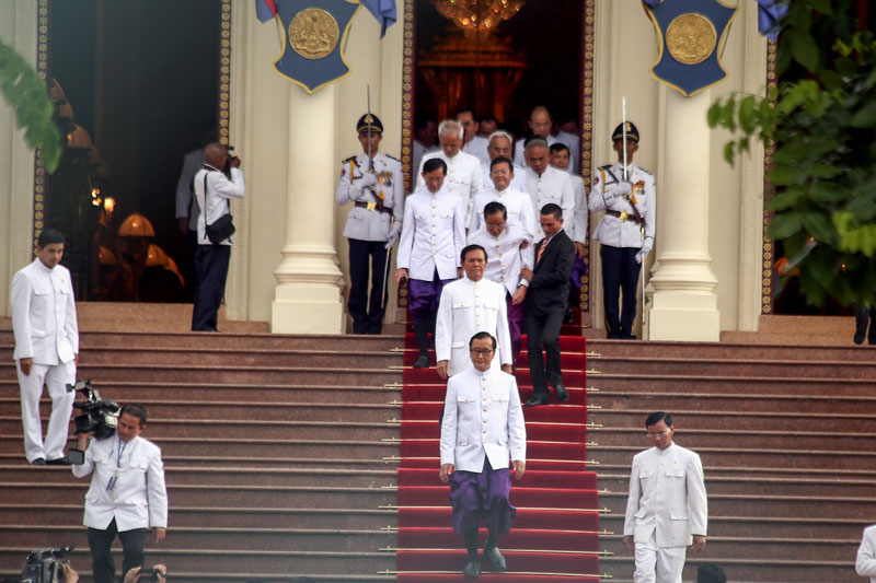 Sam Rainsy leads the CNRP’s 54 other lawmakers out of the Royal Palace in August evening after being sworn in to office by King Norodom Sihamoni. (Siv Channa/The Cambodia Daily)