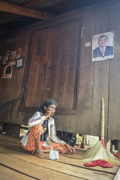 Pan Voeun sits in her home Wednesday in Koh Kong province's Areng Valley. (Zsombor Peter/The Cambodia Daily)