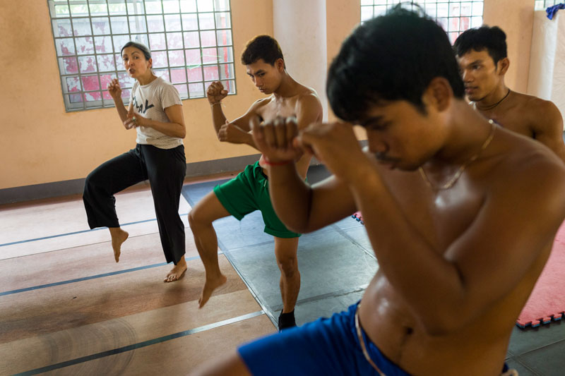 From left; choreographer Emmanuele Phuon rehearses her latest dance, 'Brodal Serei,' with dancers Nget Rady, Noun Sovitou and Khon Chan Sithyka in Phnom Penh last month. (John Vink)