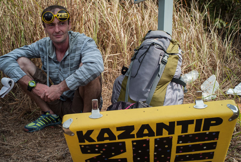 Kazantip veteran Andrey Slarilok sits on a bank near the bridge to Koh Puos island in Sihanoukville on Thursday. (Joe Hofmann)