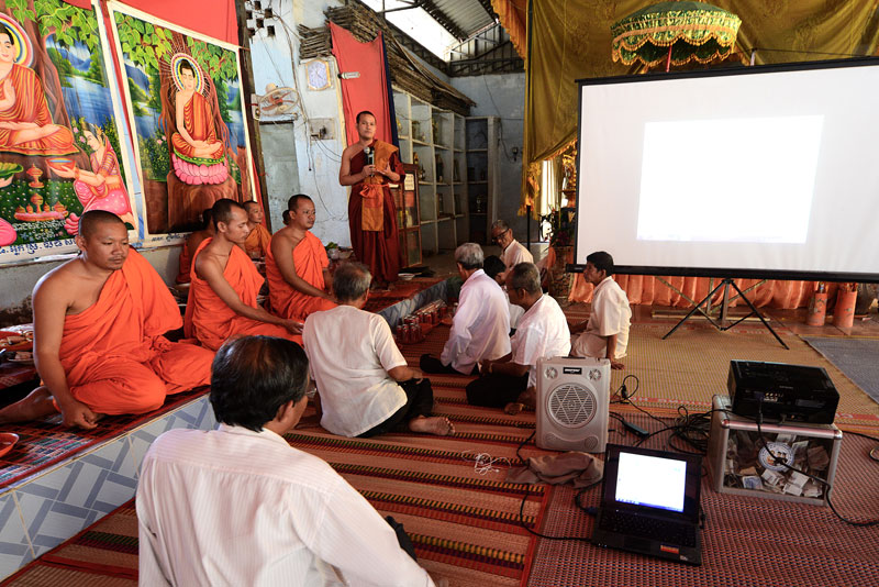 Monks and laymen at Phnom Penh's Samakki Raingsey pagoda hold a videoconference with supporters in Canada and Australia on Wednesday. (Matt Walker)