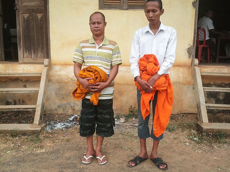 Defrocked monks Lach Hean, left, and Hem Panha (Prak Sokun)