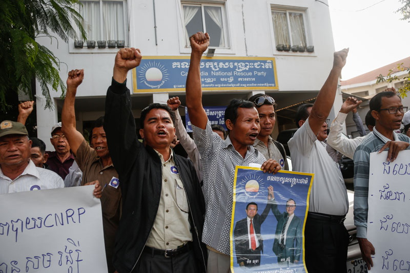 CNRP officials from Siem Reap province protest outside the opposition party's Phnom Penh headquarters Monday morning to demand the removal of their provincial party head. (Siv Channa/The Cambodia Daily)