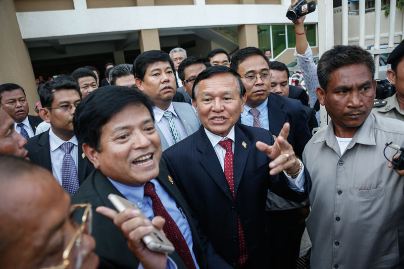 CNRP Vice President Kem Sokha emerges from the Phnom Penh Municipal Court on Wednesday afternoon after a prosecutor questioned him for seven hours over protests following the 2013 national election. (Siv Channa/The Cambodia Daily)