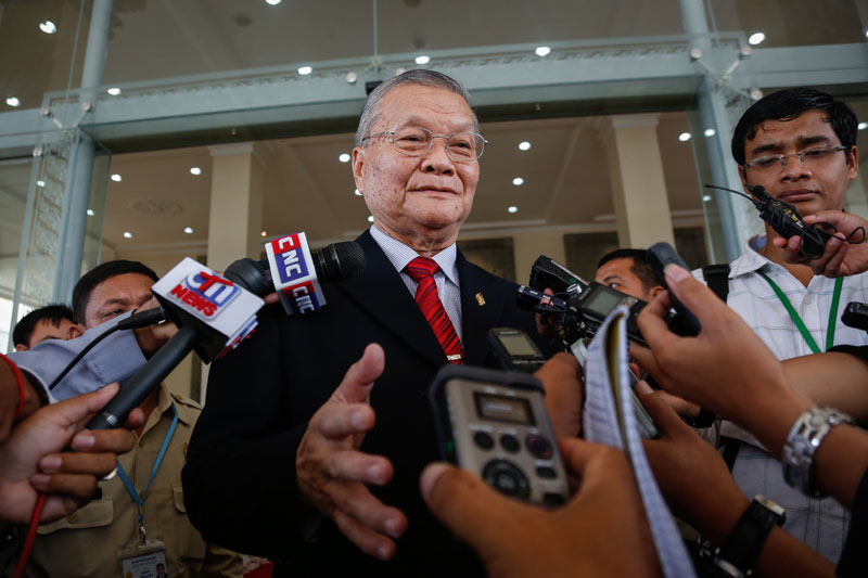Incoming National Election Committee Chairman Sik Bunhok speaks to reporters after the National Assembly approved the new committee's nine members Thursday morning. (Siv Channa/The Cambodia Daily)