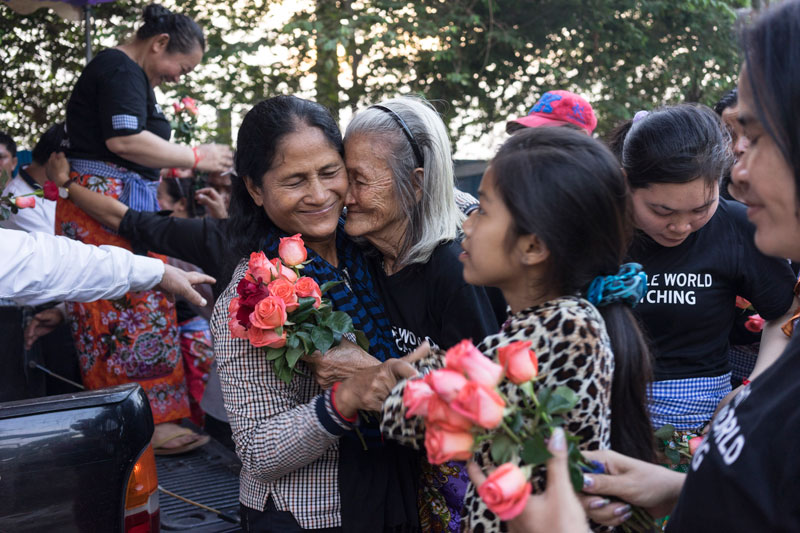 Land-rights activist Nget Khun greets relatives in Phnom Penh's Boeng Kak neighborhood after being released from prison on Saturday. (John Vink)