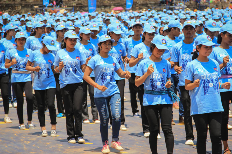 Students dance the Madison during the Angkor Sankranta New Year festival in Siem Reap City on Wednesday. Exactly 2,015 people performed the line dance, setting the Guinness World Record for largest number of participants. (Angkor Sankranta) 