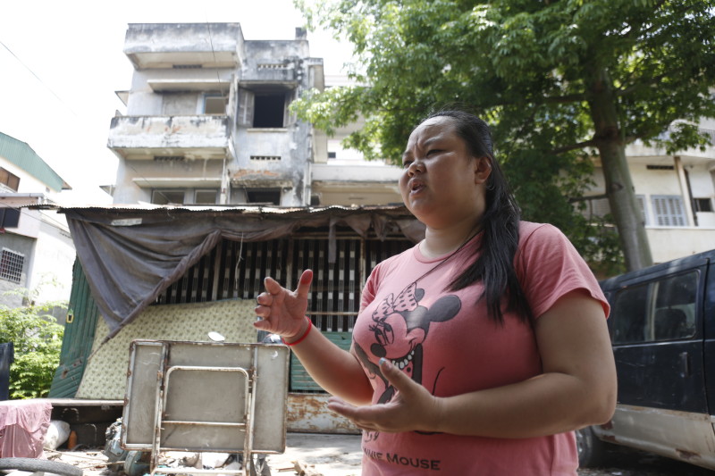 Ly Seav Minh speaks to a reporter outside her home in Phnom Penh's Tuol Kok district following her release from prison on Friday. (Siv Channa/The Cambodia Daily)