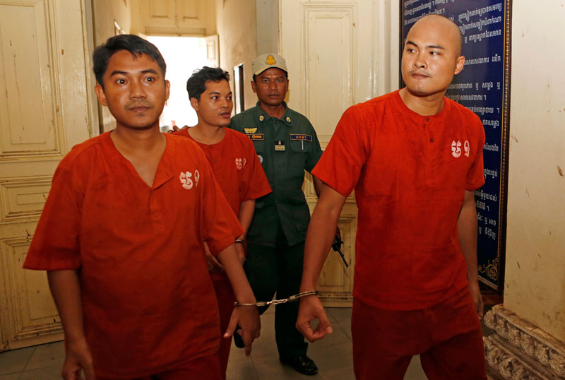 From left to right: Serey Bunlong, Seng Sok Meng and Um Phearun, convicted members of the Khmer People Power Movement, arrive at the Appeal Court in Phnom Penh on Thursday. (Siv Channa/The Cambodia Daily)