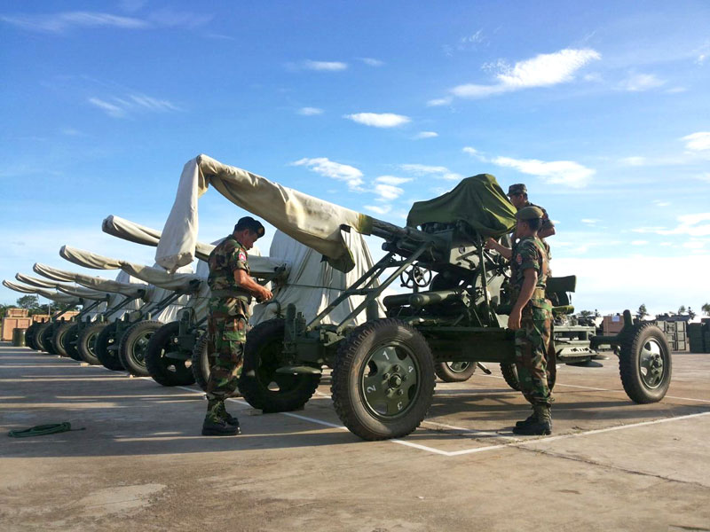 Anti-aircraft guns are displayed during a ceremony marking China's donation of military equipment to Cambodia at the Army Institute in Kompong Speu province on Saturday. (Khem Sovannara)