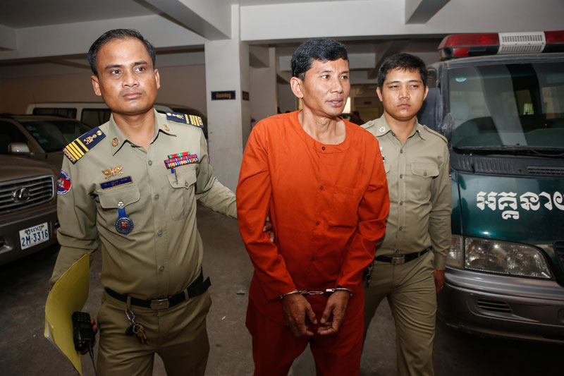 Former municipal penal police officer Hang Vuthy leaves the Phnom Penh Municipal Court on Thursday after his 2009 conviction over a failed plot to murder National Military Police Commander Sao Sokha was upheld. (Siv Channa/The Cambodia Daily)