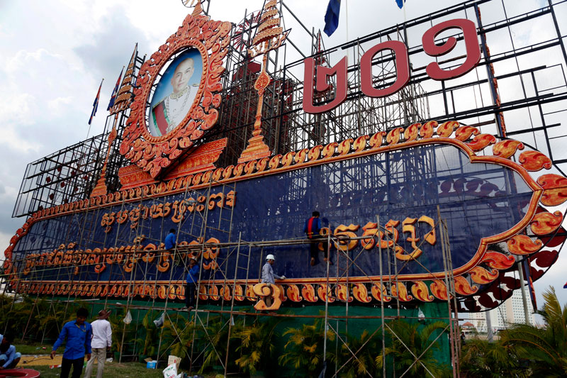 Workers renovate a structure in front of the Royal Palace in Phnom Penh dedicated to King Norodom Sihamoni on Wednesday. (Siv Channa/The Cambodia Daily)