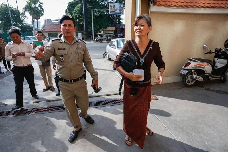 Opposition lawmaker Mu Sochua arrives for questioning at the Phnom Penh Municipal Court on Monday. (Siv Channa/The Cambodia Daily)
