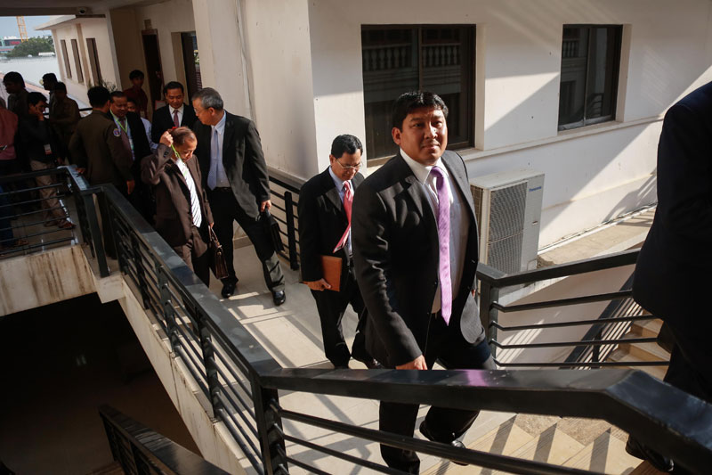 Environment Minister Say Sam Al, right, leaves a meeting with the human rights commission at the National Assembly on Tuesday. (Siv Channa/The Cambodia Daily)