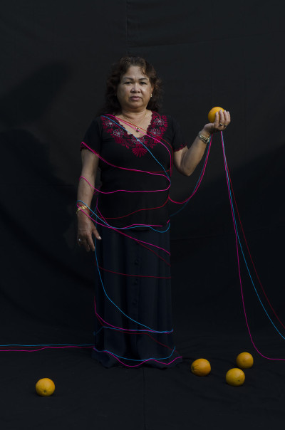 Choun Ponh poses with oranges, a fruit that nearly cost her life. (Neak Sophal)