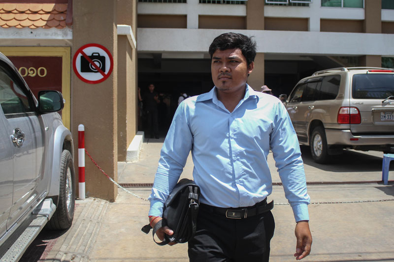 Neang Sokhun, a CNRP Youth leader from Phnom Penh's Chbar Ampov district, leaves the Phnom Penh Municipal Court on Wednesday. (Siv Channa/The Cambodia Daily)