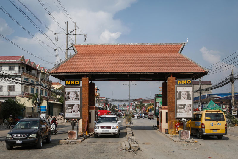 Vehicles drive through a tollbooth on Street 2004 in Phnom Penh's Sen Sok district on Monday. (Siv Channa/The Cambodia Daily)