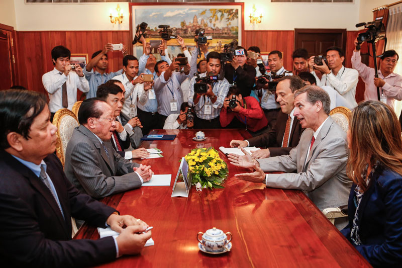 Scott Busby, US deputy assistant secretary of state for democracy, human rights and labor, center right, speaks to Foreign Affairs Minister Hor Namhong during a meeting in Phnom Penh on Tuesday. (Siv Channa/The Cambodia Daily)