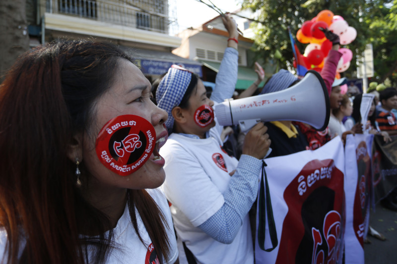 Women shout slogans during a protest against the NGO law on Friday outside the Senate in Phnom Penh. CPP senators approved the law during a session boycotted by opposition senators. (Siv Channa/The Cambodia Daily)