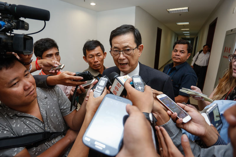 Var Kimhong, the minister in charge of border affairs, speaks to reporters after the second day of meetings with Vietnamese officials at the Council of Ministers building in Phnom Penh on Wednesday. (Siv Channa/The Cambodia Daily)