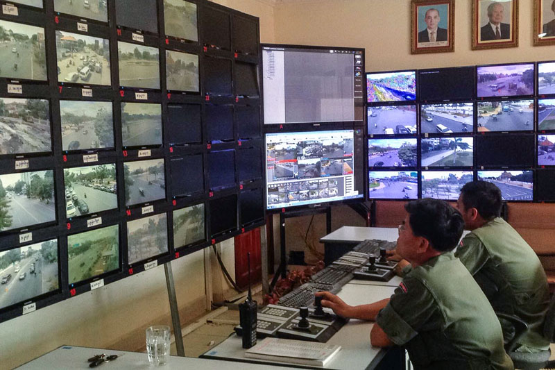 National Police Officers from the National Police's radio communication department watch monitors linked to surveillance cameras in Phnom Penh on Tuesday.