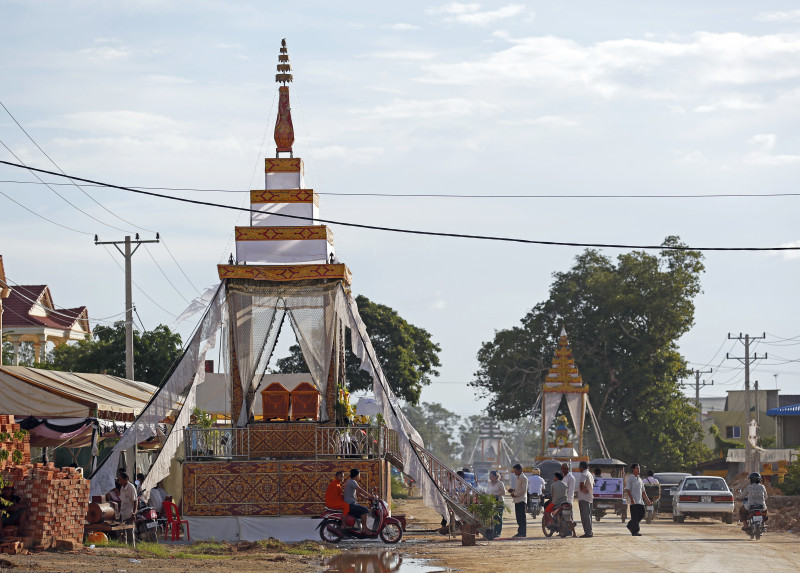 Three funeral pyres line the road in Phnom Penh’s Prey Sar commune, the home of all 16 passengers who died in a bus crash in Oddar Meanchey province on Thursday during a religious pilgrimage. (Siv Channa/The Cambodia Daily)