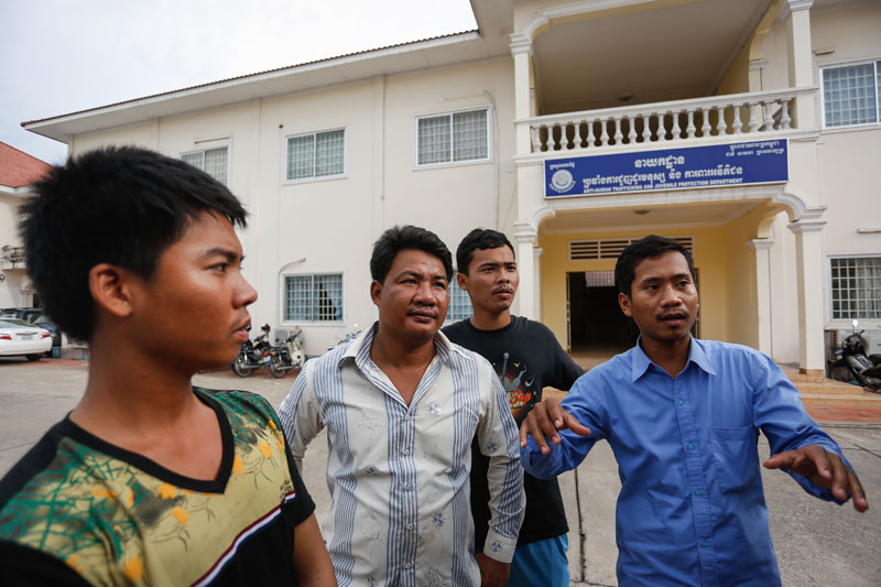 From left: Heang Buntong, Tang Chanthorn, Sorm Chamroeun and In On speak to reporters outside the headquarters of the Interior Ministry's anti-human trafficking department in Phnom Penh on Tuesday. (Siv Channa/The Cambodia Daily)