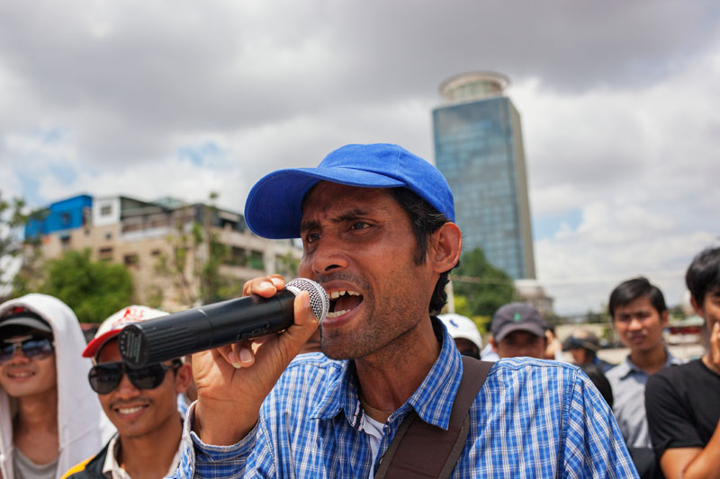A demonstrator speaks during a protest at Phnom Penh's Freedom Park on Sunday over the arrest of two men in Kampot province last week. (Jens Welding Ollgaard/The Cambodia Daily)