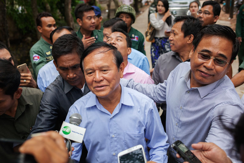 CNRP Vice President Kem Sokha talks to reporters outside Phnom Penh's Prey Sar prison on Wednesday. (Jens Welding Ollgaard/The Cambodia Daily)