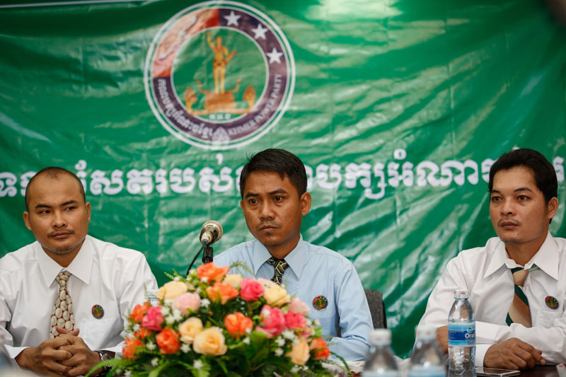 From left, Um Phearun, Serey Bunlong and Seng Sok Meng attend a press conference at the Phnom Penh headquarters of the Khmer Power Party on Wednesday. (Siv Channa/The Cambodia Daily)