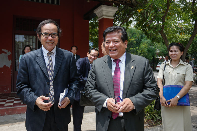 Secretary of state at the Ministry of Culture, Thai Noraksathya, left, stands with Yem Ponhearith, head of the National Assembly's commission on culture, at the Royal University of Fine Arts on Tuesday. (Siv Channa/The Cambodia Daily)