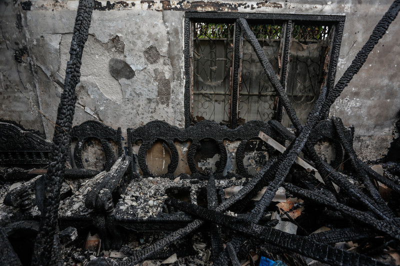 Charred furniture is seen on Friday inside an apartment destroyed by fire behind Java Cafe & Gallery in Phnom Penh the night before. The fire gutted five apartments and an office belonging to the gallery, where hundreds of pieces of art had been stored. (Siv Channa/The Cambodia Daily)