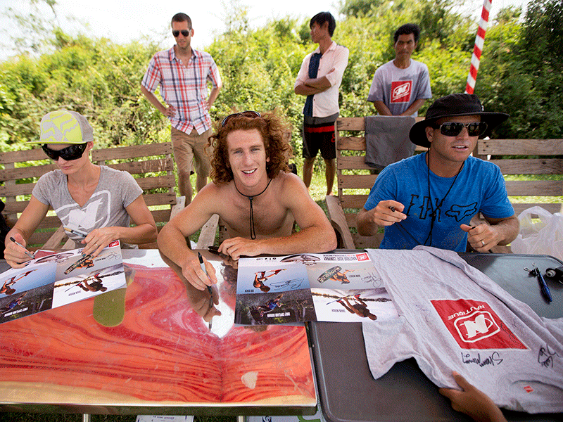 Emily Durham, left, Bob Soven, center, and Shaun Murray, right, sign autographs for fans at the Kam-Air Wakepark on Saturday. (Olivia Harlow) 