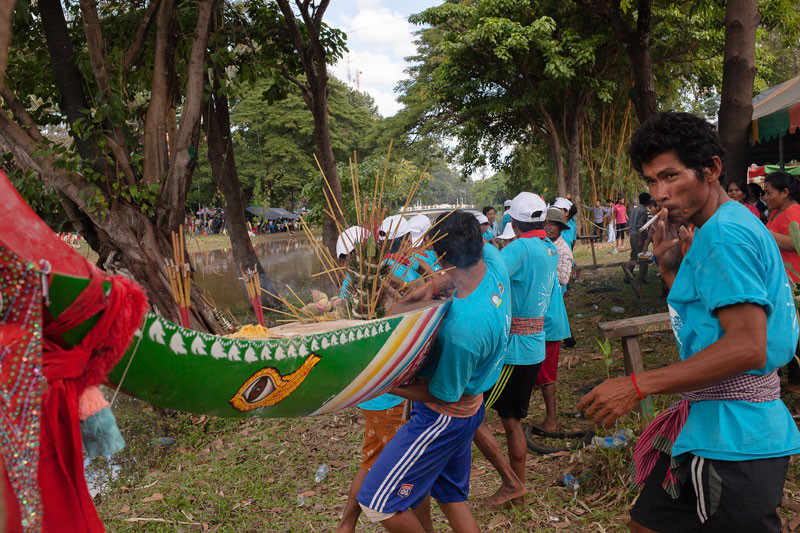 Members of the Hanuman Senchey Baramey Srey Kroup Leak team prepare to lower their boat into the river on Tuesday. (Jens Welding Ollgaard/The Cambodia Daily)
