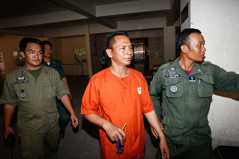 Brigadier General Pech Prum Mony, a former bodyguard for disgraced Phnom Penh Municipal Court director Ang Mealaktei, leaves the court on Friday. (Siv Channa/The Cambodia Daily)