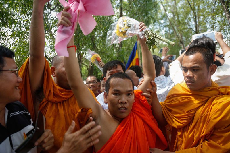 Soeung Hai celebrates upon being released from Prey Sar prison in Phnom Penh in April. (Siv Channa/The Cambodia Daily)