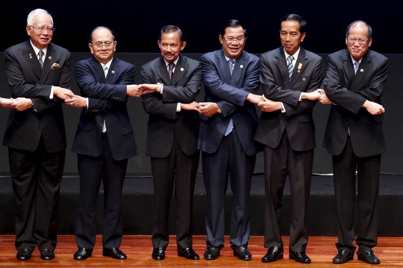 Prime Minister Hun Sen, third from right, poses for a photograph with fellow Asean leaders during the 26th Asean Summit in Kuala Lumpur last year. (Reuters) 