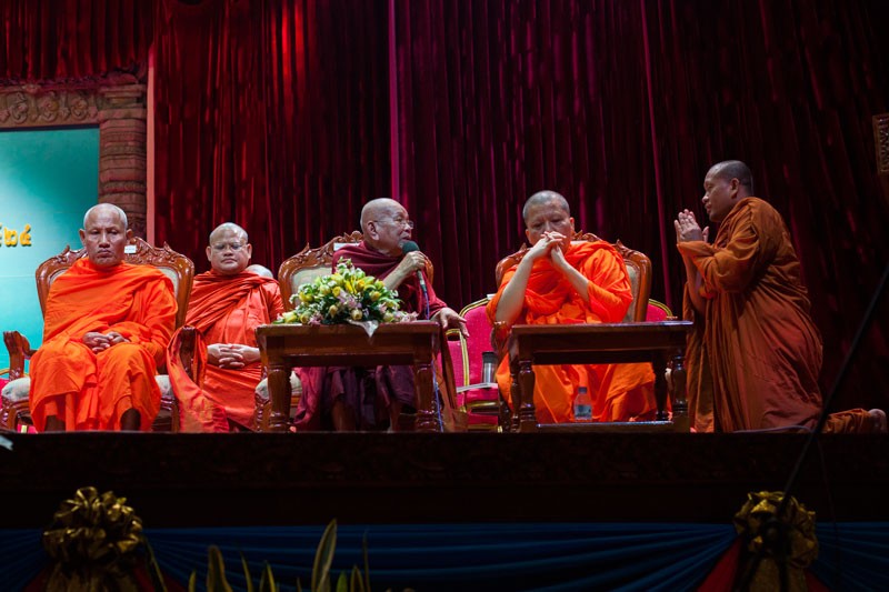 Non Nget, in maroon, the supreme patriarch of the Mohanikaya Buddhist sect, addresses hundreds of senior monks and monastic officials at the 24th annual monk congress in Phnom Penh's Chaktomuk Theater on Wednesday.