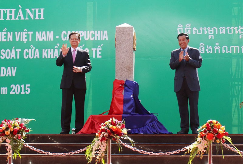 Prime Minister Hun Sen, right, and his Vietnamese counterpart, Nguyen Tan Dung, inaugurate a new border demarcation post in Ratanakkiri province in December. (Reuters)