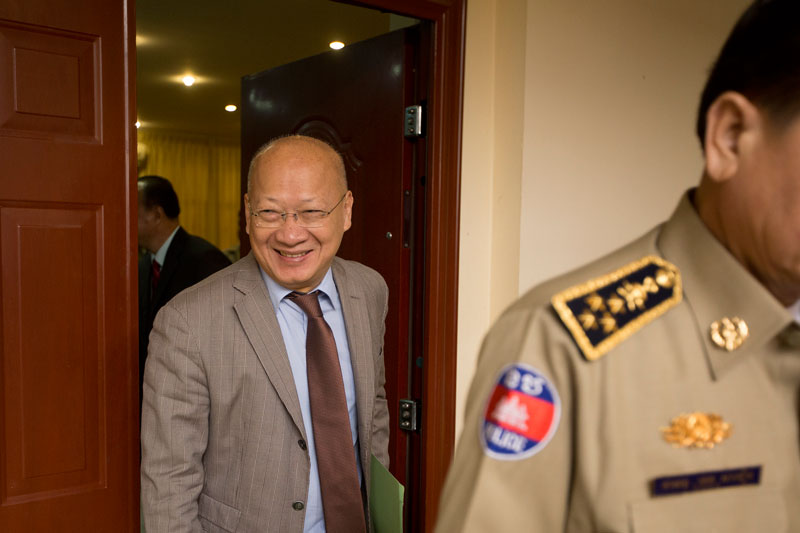 Justice Minister Ang Vong Vathana leaves a meeting at the ministry yesterday. (Olivia Harlow/The Cambodia Daily)