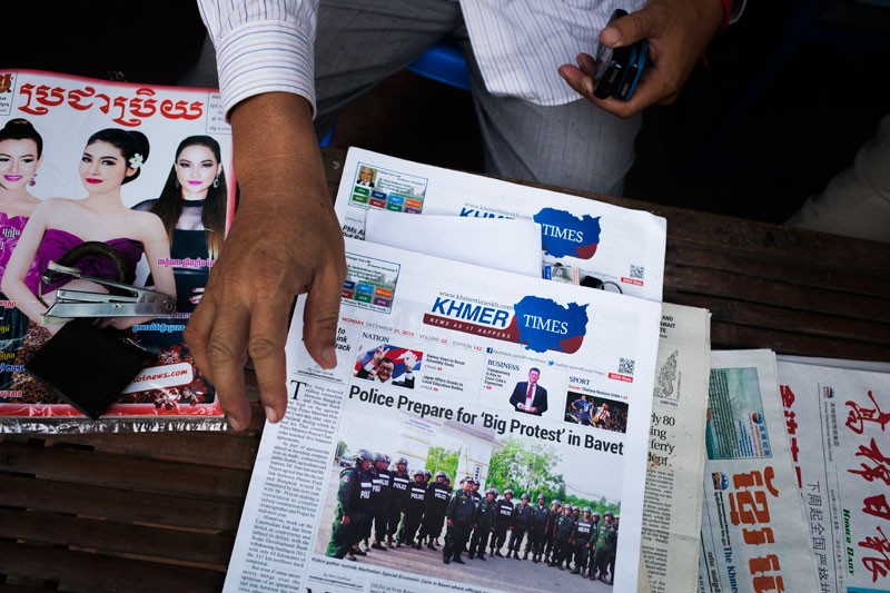 The Khmer Times is displayed at a newsstand in Phnom Penh on Monday. (Jens Welding Ollgaard/The Cambodia Daily)