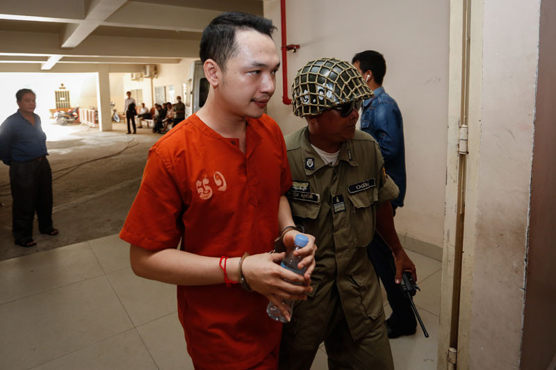 Hong Kalidin arrives at the Phnom Penh Municipal Court on Tuesday.