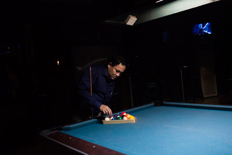 A man plays pool at Sharky on Wednesday. (Jens Welding Ollgaard/The Cambodia Daily)